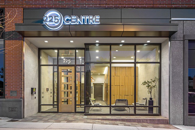 the front of a building with a lobby and a glass door